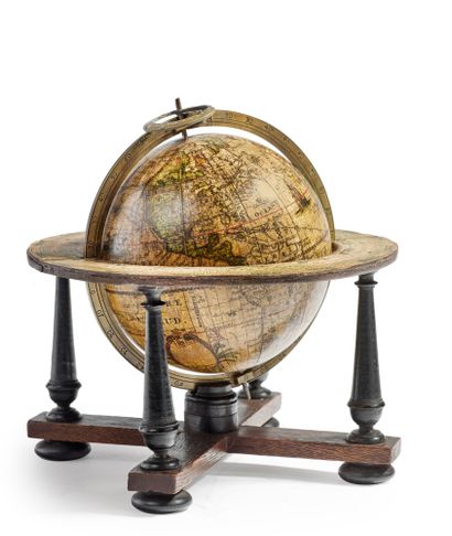 null 
Globe captioned mainly in Latin. It rotates in its brass meridian circle with...