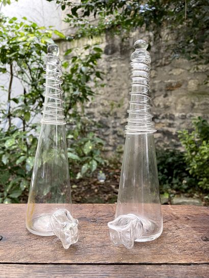 null Two transparent colorless glass bird feeders. Conical with hot applied fillets.

Late...
