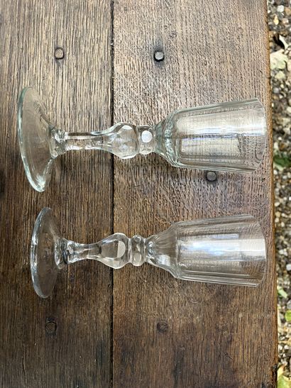null 
Two blown and faceted glass stemmed glasses.


Late 18th century


H. 15,5...