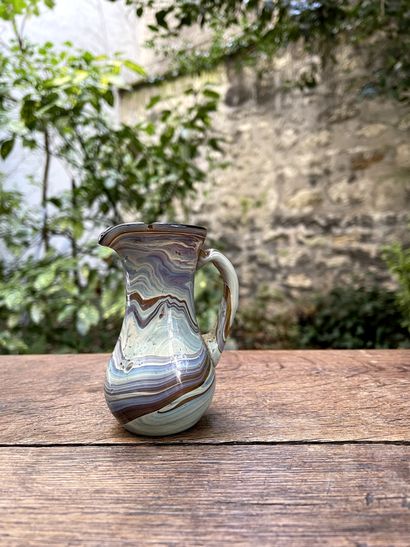 null Small blown glass pitcher.

19th century

H. 9 cm

(small chip on the neck)