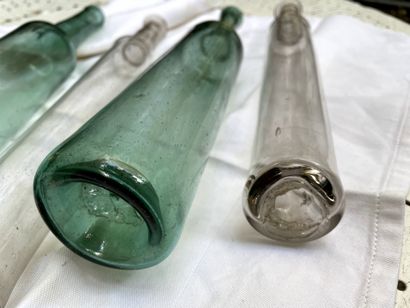 null Four glass bottles, one pair colored blue-green.

Late 18th century

H. of one...