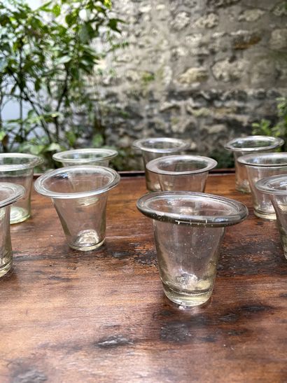  Ten small transparent colorless glass jelly jars of truncated cone shape. 
France,...