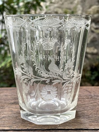 null 
Glass goblet cut and engraved with a flowery garland and bearing the inscription...