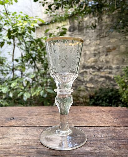 Blown glass wine glass with armorial decoration...
