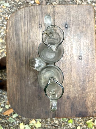 null 
Cruets in blown and moulded glass, translucent, slightly grey. 



Work in...