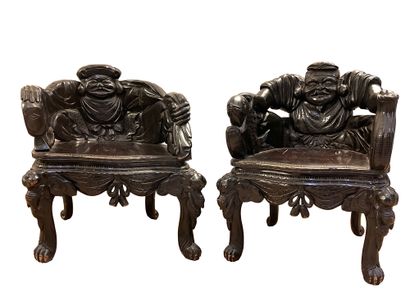 Pair of blackened carved wood armchairs with...