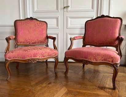 Pair of flat-backed armchairs in carved wood...