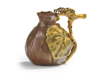 CHRISTOFLE Vase forming a small pitcher in bronze with a brown and golden patina...