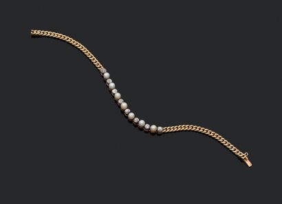 null Bracelet en or 750 et argent 800 millièmes, composé d'une ligne de perles alternées...