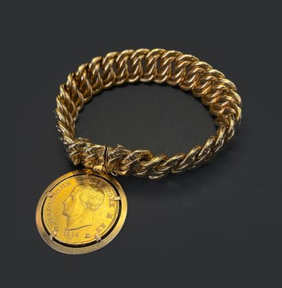 null Gold bracelet 750 thousandths, American curb chain partially chiseled retaining...