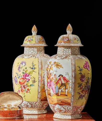 Pair of ovoid covered vases in polychrome...
