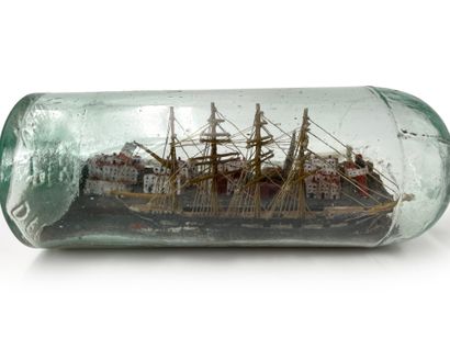 null Boat in bottle Four masts barque on a background of harbor city and lightho...