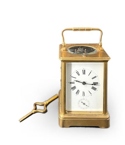null Travel clock with gilded brass cage, beveled glass top and sides, white rectangular...