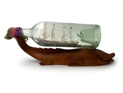 null Boat in bottle Four masts barque on sea in painted putty
Wooden support with...
