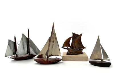Suite of three miniature sailboats in metal...