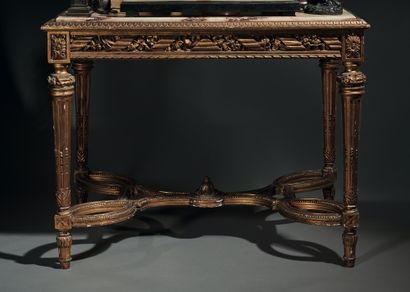 null Middle table in carved and gilded wood decorated with leafy friezes. Four fluted...