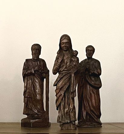 Set of three carved wood subjects with patina:...