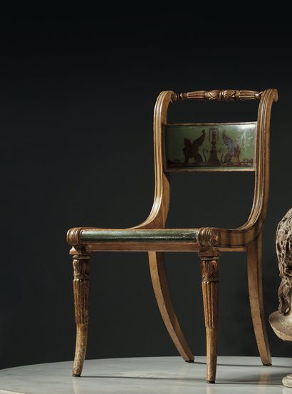 null Four chairs in molded and carved wood with a reversed back decorated with a...