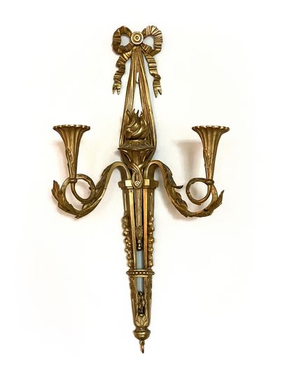 null Pair of sconces in molded, carved and gilded bronze with two arms of light decorated...