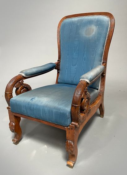 Moulded and carved wooden armchair with a...