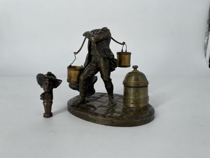 null Inkwell in patinated bronze with decoration of a carrier, terminal forming inkwell...