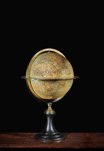 null Earth sphere with graduated brass meridian and equatorial circles on a blackened...