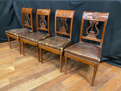 null Suite of four mahogany and mahogany veneer chairs with an openwork back with...