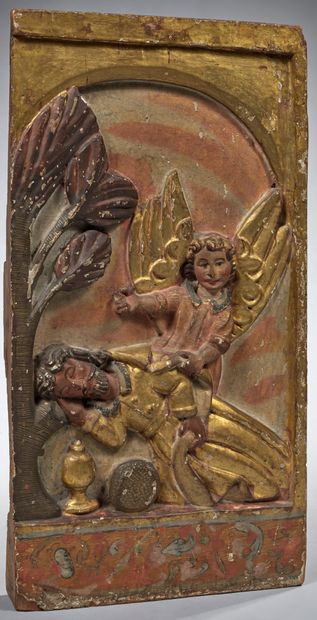 null # Oak panel carved in high relief, polychromed and gilded, decorated with the...