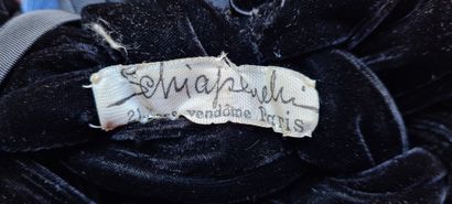 SCHIAPARELLI Black velvet braid headdress with a faille bow of the same tone.
Signed...