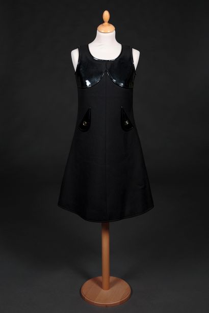COURREGES Afternoon dress trapeze shape in black wool, round neck, sleeveless, and...