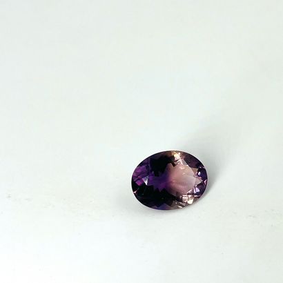 Faceted oval ametrine weighing 11.3 cts probably...