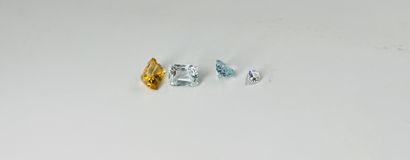 null Lot of four stones including a white stone, two aquamarines and a citrine.Total...