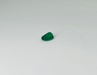 null Oval emerald weighing 4.73 cts. (Accompanied by an AIG certificate indicating...