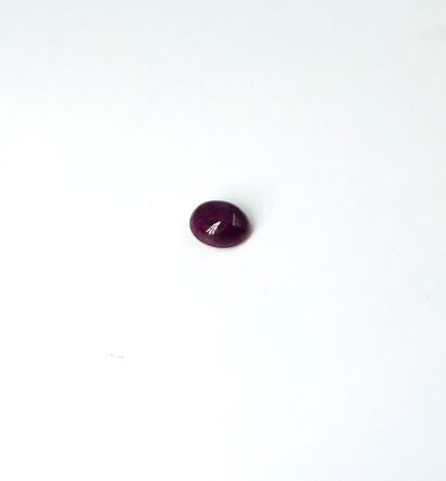 Ruby cabochon weighing 3.10 carats. With...