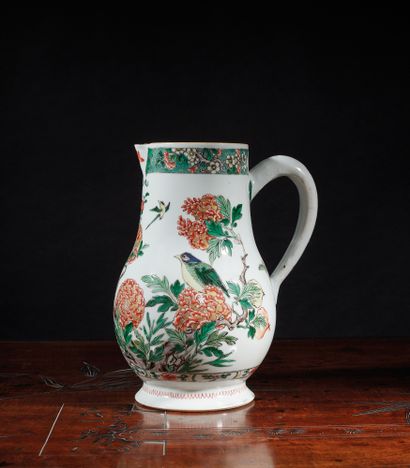 null Porcelain jug decorated in polychrome enamels of the green family with kingfishers...