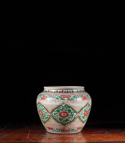 null Porcelain pot decorated in "wucai" enamels with reserves decorated with flowers...