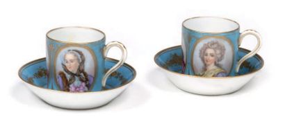 null Pair of porcelain mocha cups with a blue background enhanced with gold and polychrome...