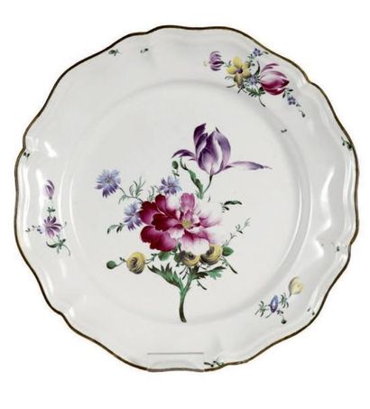 STRASBOURG Plate with contoured edge with polychrome decoration of a broad bouquet...