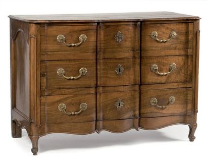 null Chest of drawers with a crossbow profile in molded walnut opening with three...