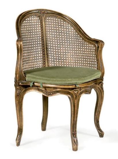 null Office chair with cane bottom in molded wood and gilded with flowers. Wrapping...