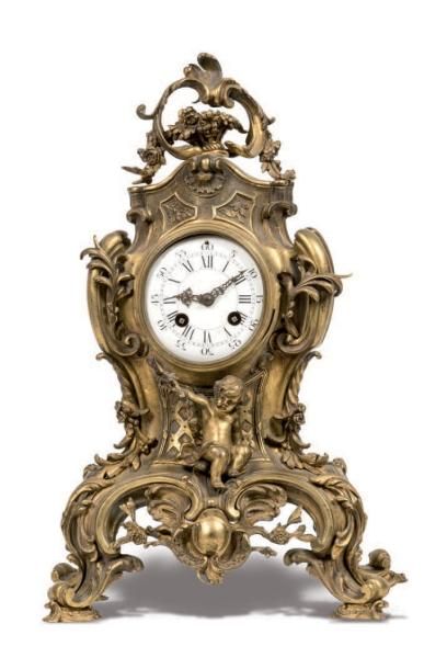 null Clock in gilt bronze decorated with a love, palms and rocaille White enamelled...