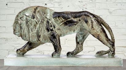 JEANNE PIFFARD (1892-1971) 
Walking Lion - About 1930
Ceramic sculpture with green...