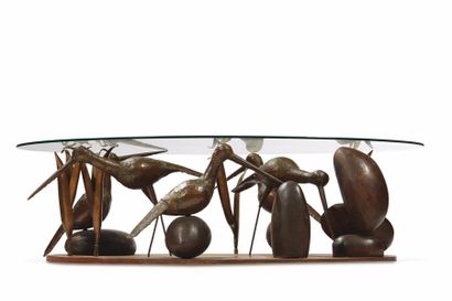 René BROISSAND (né en 1926) 
Exceptionnelle table basse à plateau ovale en verre...