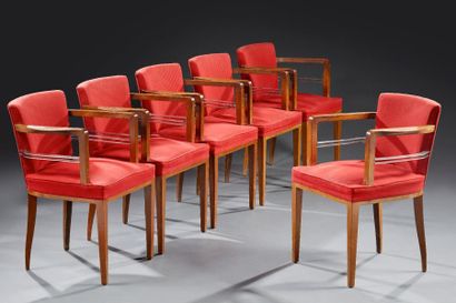 Jean PASCAUD (1903-1996) Suite de six fauteuils en noyer et métal nickelé à dossiers...