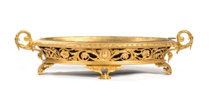 BALDI, Florence Centre de table de forme ovale en bronze doré à décor de fleurs et...