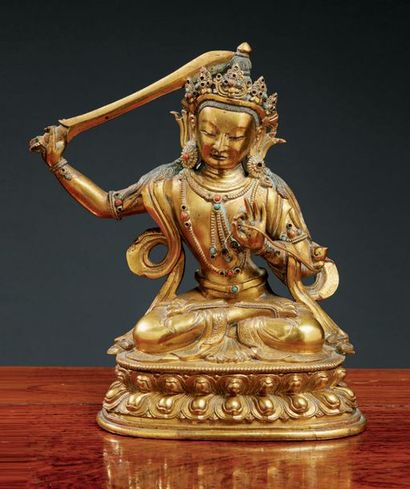 TIBET - XVIIIe siècle Statuette de Manjusri en bronze doré, assis en padmasana sur...