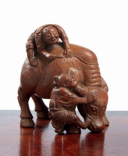 CHINE - XXe siècle Groupe en bambou sculpté, deux enfants avec un buffle.
H. 12,5...