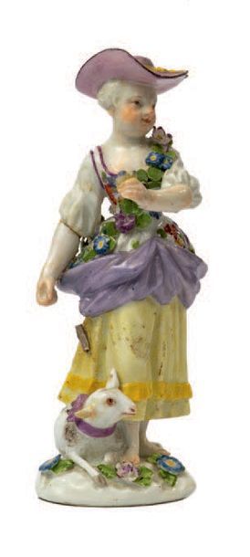 MEISSEN Statuette en porcelaine polychrome figurant une jeune femme portant une guirlande...