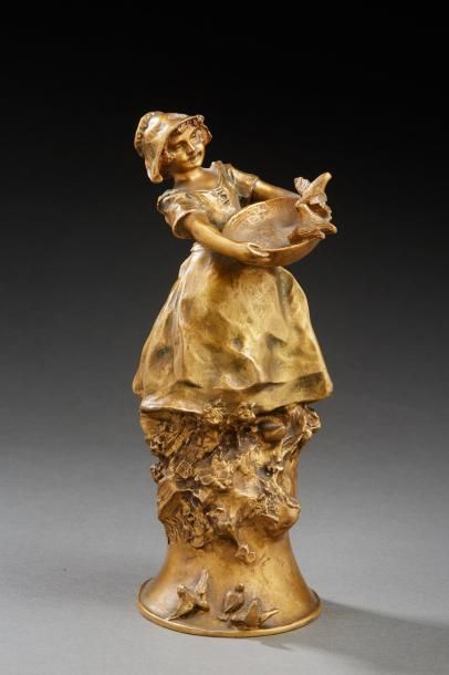 Charles KORSCHANN (1872-1943) 
Sculpture en bronze doré figurant une fillette nourrissant...