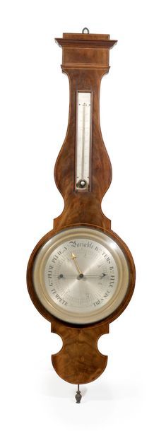  Baromètre-thermomètre de forme violonée en placage d'acajou marqueté d'un filet....